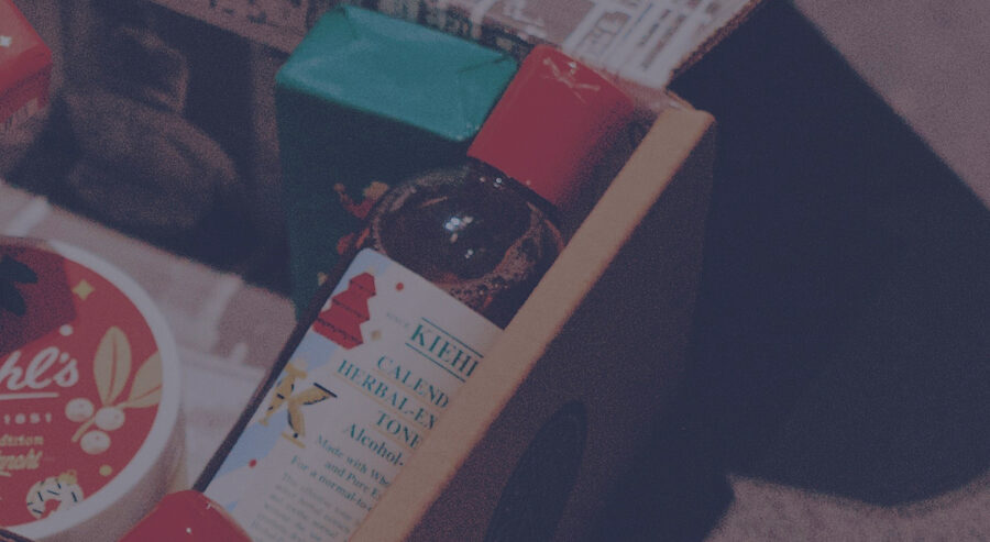 A gift order in an open shipping carton, the products still wrapped.